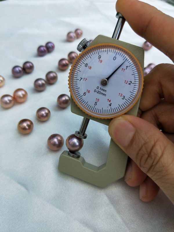 loose round purple pearls