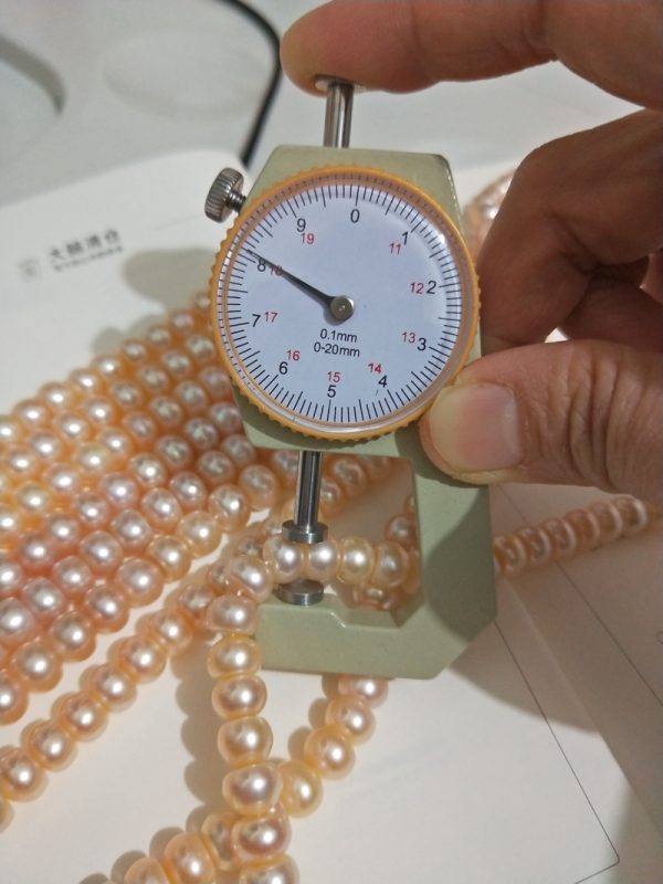 pink button shaped freshwater pearls