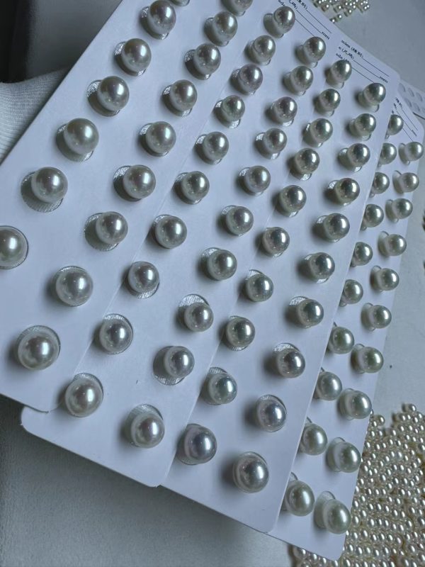 white cultured round studs pearls