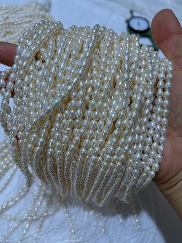 16-inch strands of 4mm white cultured rice-shaped freshwater pearls in bulk high luster - Image 4